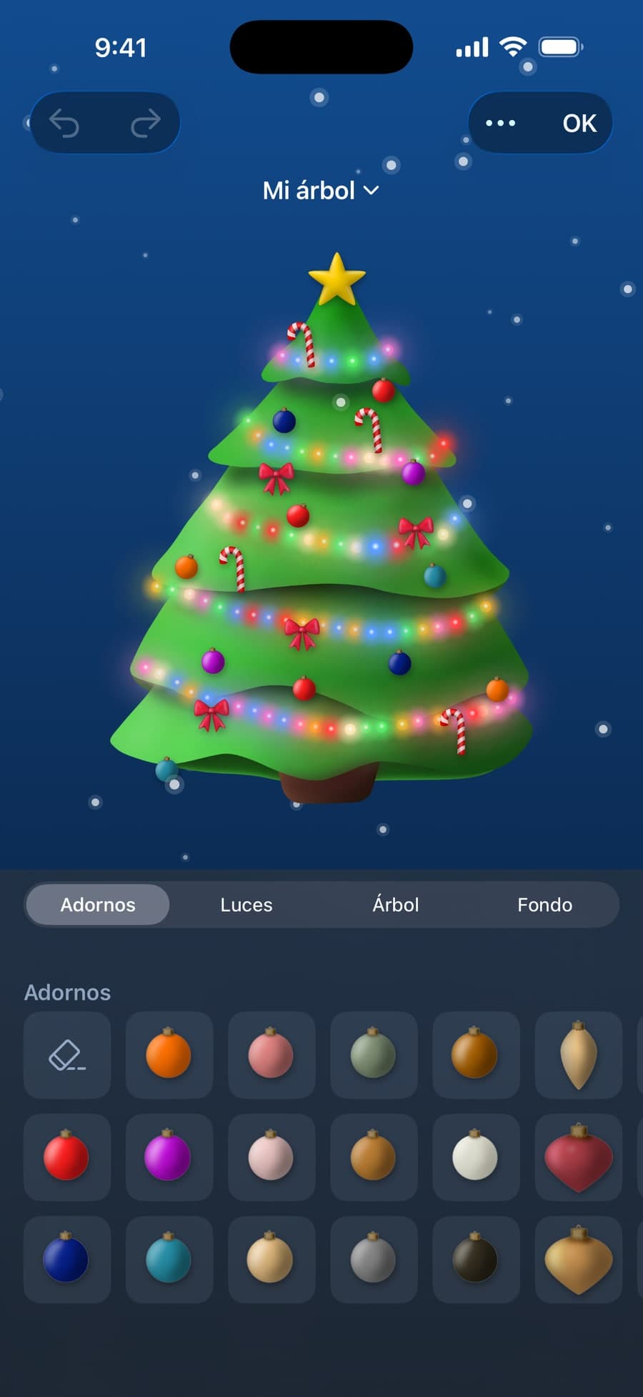 Decorando el árbol en el iPhone, con la paleta de adornos abierta