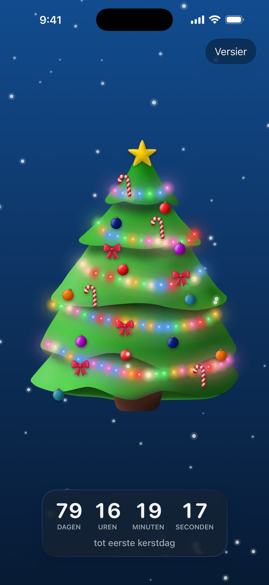 De versierde boom op iPhone, met vallende sneeuw en een aftelling tot Kerstmis